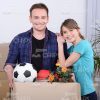 Married Couple Moving To New Apartments Stock Photo
