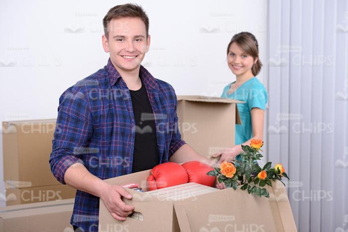 Stock Photo Young Couple Moving to New Home