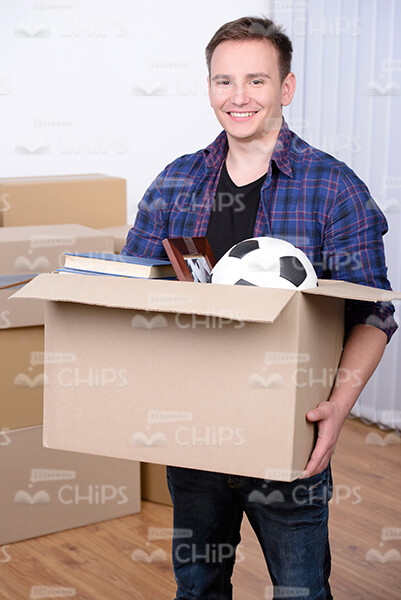 Happy Man Holds Large Cardboard Box Stock Photo