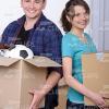 Happy Young Couple Standing Back to Back Stock Photo