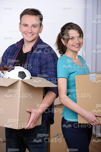 Happy Young Couple Standing Back to Back Stock Photo