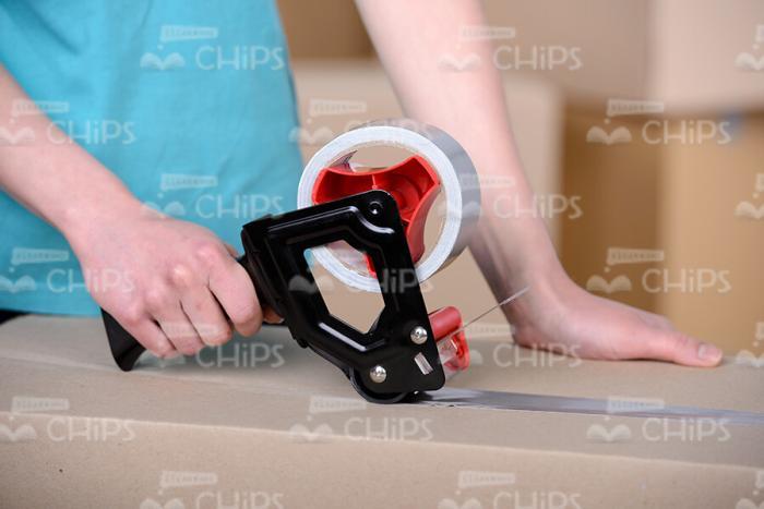 Woman's Hands Holding Adhesive Tape Stock Photo