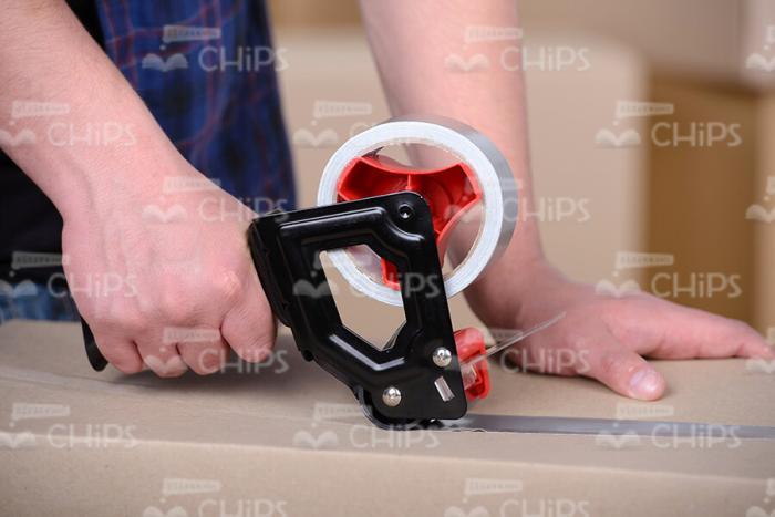Adhensive Tape in Man's Hands Stock Photo