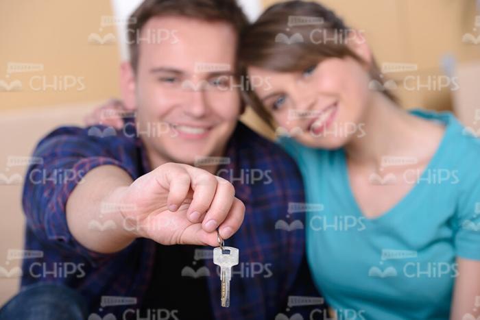 Married Couple Showing Keys to New Apartment Stock Photo