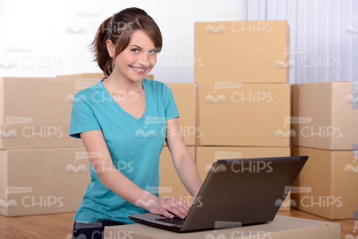 Happy Girl Working on Laptop Stock Photo