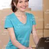 Smiling Woman Typing on Laptop Stock Photo