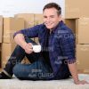 Young Man Holding Small White Cup Stock Photo