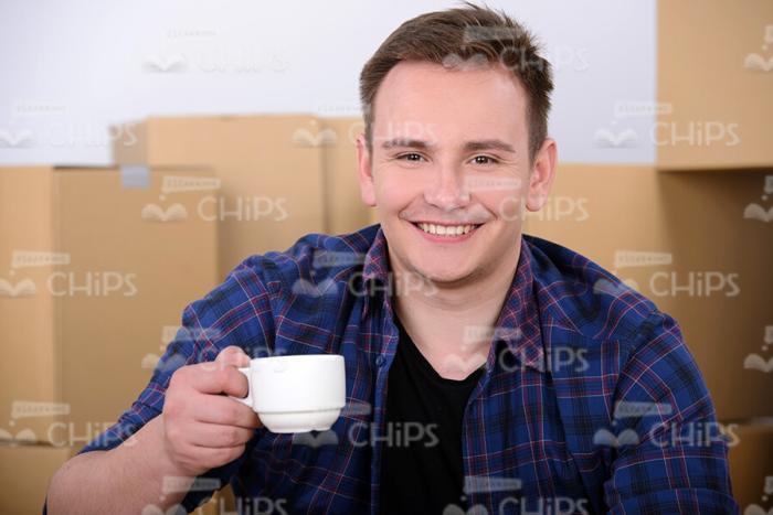 Happy Man Holds Coffee Cup Stock Photo