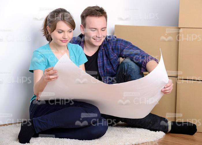 Young Couple With Drawing Stock Photo