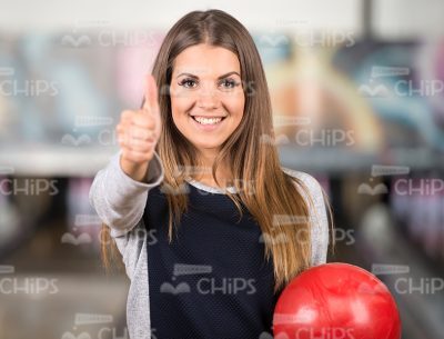 Smiling Woman Shows Thumb Up Stock Photo