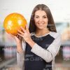 Happy Girl Holding Bowling Ball Stock Photo