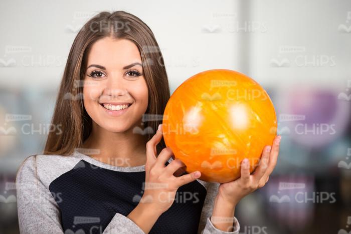 Cute Lady Holds Bowling Ball Stock Photo