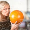 Focused Woman Going To Throw The Bowling Ball Stock Photo