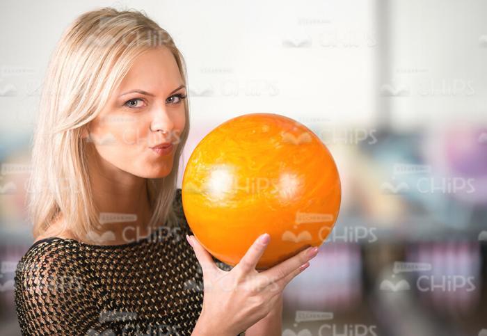 Focused Woman Going To Throw The Bowling Ball Stock Photo