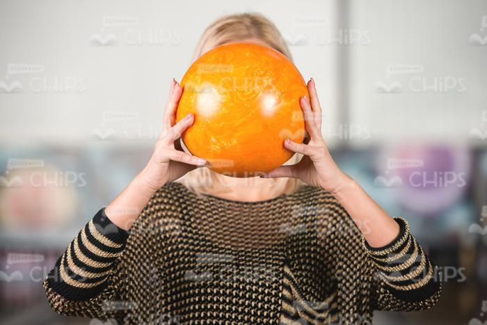 Bowling Ball In Woman's Hands Stock Photo