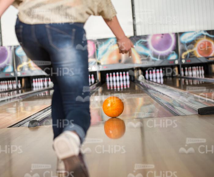 Woman Plays Bowling Stock Photo