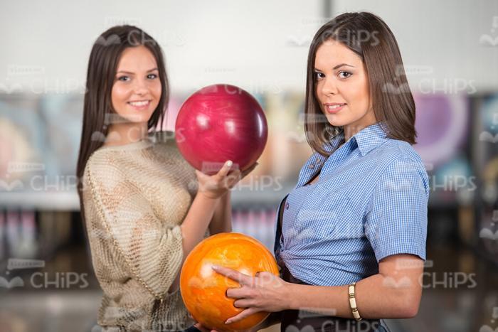 Two Pretty Women With Bowling Balls Stock Photo