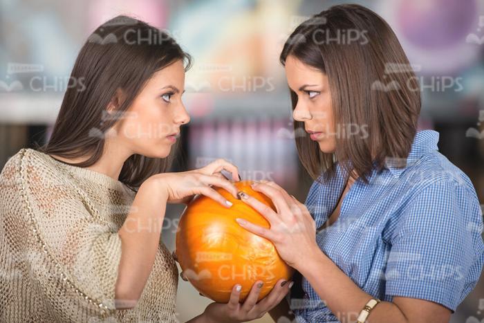 Girls Taking Bowling Ball Out Of Each Other Stock Photo
