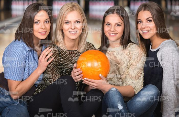 Female Colleagues Play Bowling Stock Photo