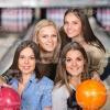 Four Female Friends At Bowling Stock Photo