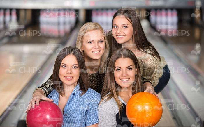 Four Female Friends At Bowling Stock Photo
