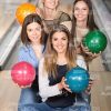 Nice Girls Holding Bowling Balls Stock Photo