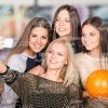Girls With Bowling Ball Are Making Photo On Mobile Phone Stock Photo