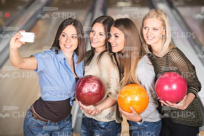 Female Friends Resting At Bowling Stock Photo