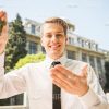 Young Man Showing Keys Stock Photo