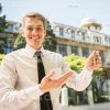 Handsome Man Presenting Keys Stock Photo
