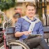 Good-Looking Man Resting And Using Tablet Stock Photo