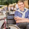 Happy Young Guy Resting On Bench Stock Photo