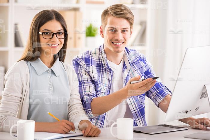 Two Happy Students Working Stock Photo