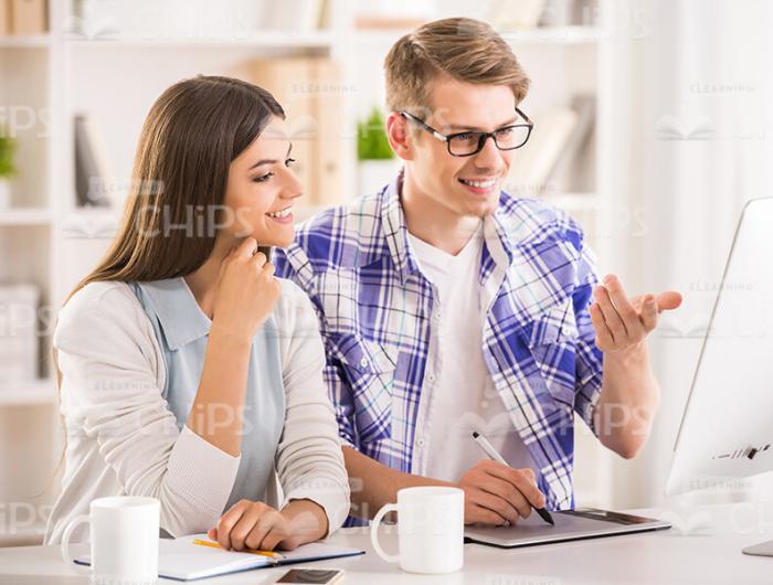 Two Happy Young Students Discussing Something Stock Photo