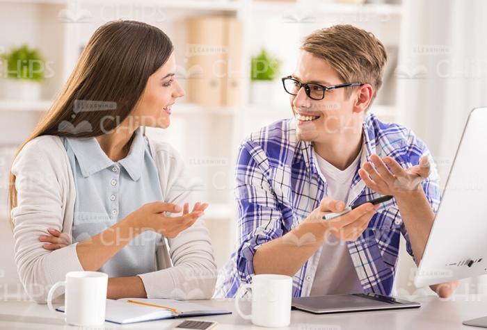 Stock Image Of Two Students Holding Conversation