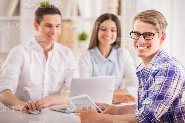 Smiling Man Holding Tablet Stock Photo