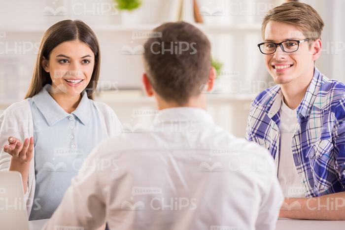 Men And Young Woman Talking On Training Session Stock Photo