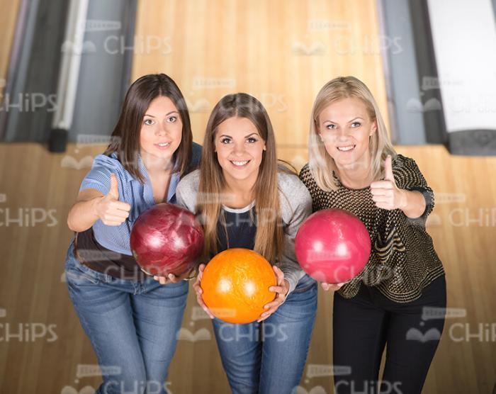 Top View On Three Satisfied Women At Bowling Alley Stock Photo