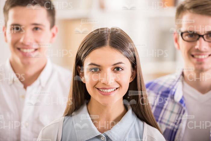 Faces Of Three Young People Stock Photo