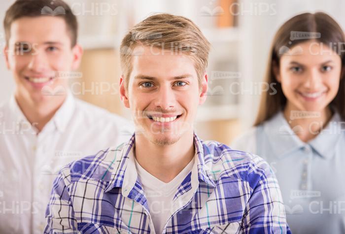 Smiling Young Men And Pretty Woman Stock Photo