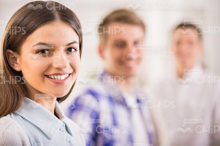 Young Woman And Her Teammates Stock Photo