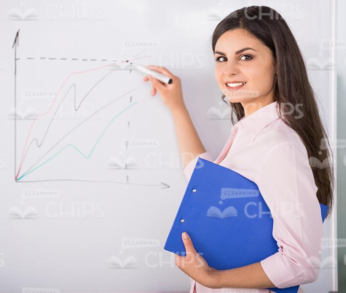 Woman Drawing Graph Stock Photo