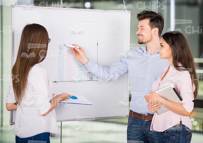 Three Young People Conduct Business Training Stock Photo