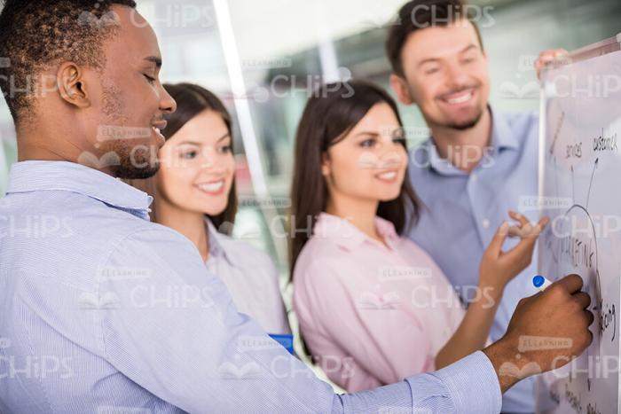 Young Managers Discussing Marketing Strategy Stock Photo