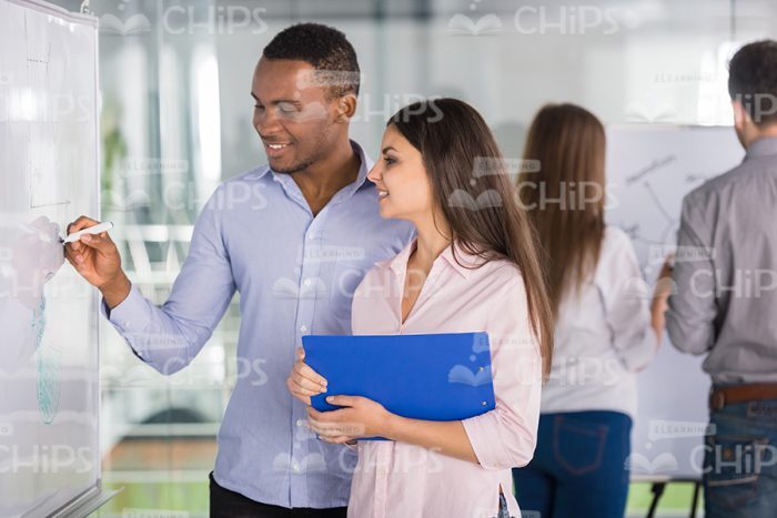 Young People At Training Work With Whiteboard Stock Photo