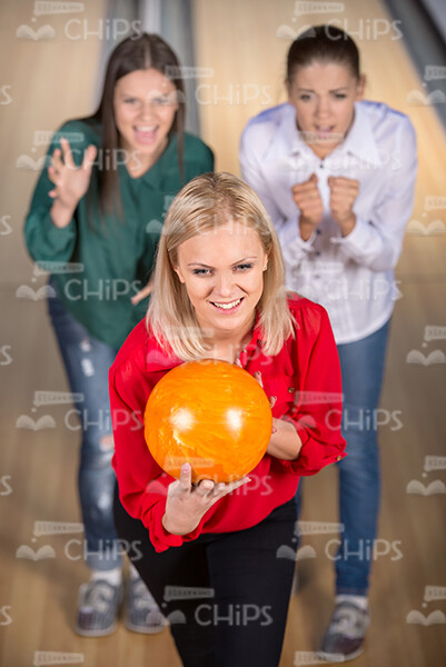 Blonde Young Woman Is Ready To Throw The Bowling Ball Stock Photo