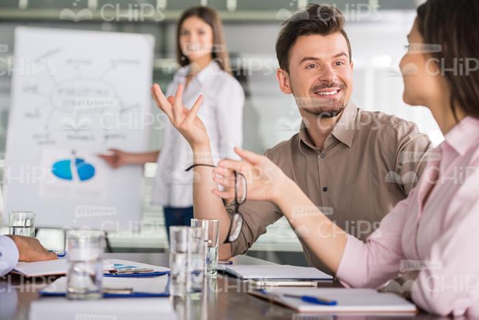 Young Man Having Discussion With His Partner Stock Photo