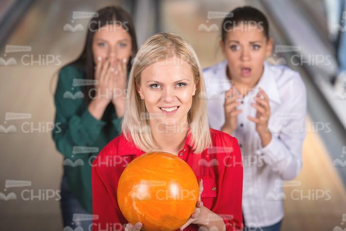Happy Blonde Woman Playing Bowling Stock Photo