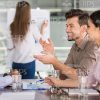 Handsome Business People Talking About The Current Training Information Stock Photo