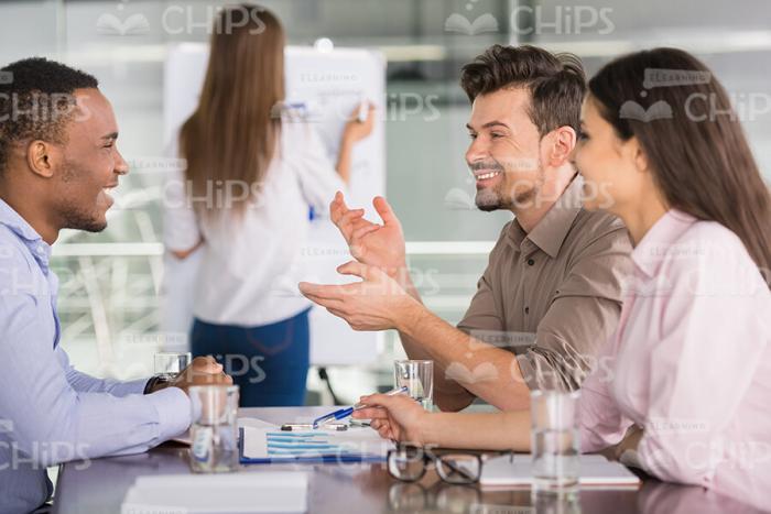 Handsome Business People Talking About The Current Training Information Stock Photo